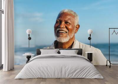 Blissful elderly man smiling by the ocean Wall mural