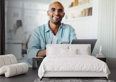 Business man using a mobile phone and sitting in an office Wall mural