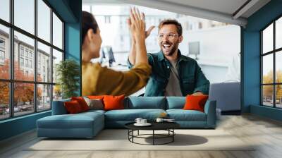 Business people celebrating success in an office Wall mural