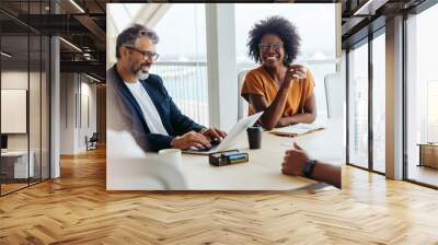 Creative professionals brainstorming in a modern office Wall mural