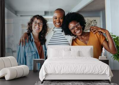 Group of three business women smiling happily in an office Wall mural