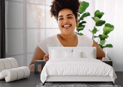 Healthy woman with glass of water at home Wall mural