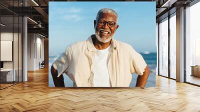 Joyful senior man smiling at the beach Wall mural