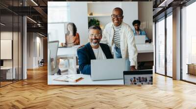 Modern office teamwork with happy colleagues planning and smiling Wall mural