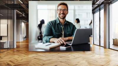 Portrait of a business man sitting in an office Wall mural