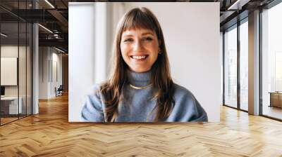 Portrait of a happy businesswoman smiling at the camera Wall mural