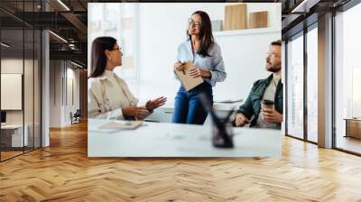 Team of design professionals having a meeting in an office Wall mural