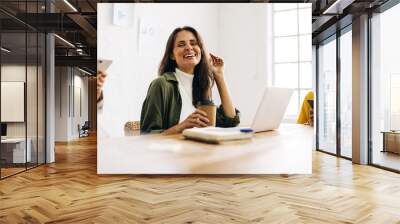 Team of professional business women having a meeting together Wall mural