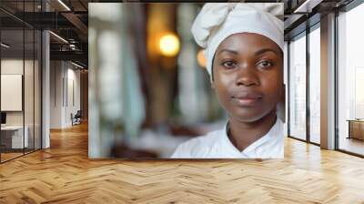 Portrait of confident black maid in hotel looking at camera.  Wall mural