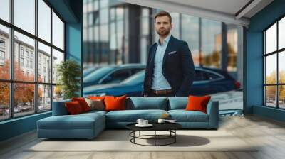 Car seller in suit in front of a modern car dealer shop.  Wall mural