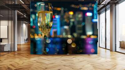 Champagne glass with a reflection of a city skyline at night, captured during a celebration Wall mural