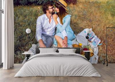 Elegant couple making tasty picnic outdoor Wall mural