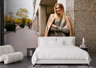 fashion street style picture of blonde elegant woman, wearing luxury silk dress, trendy sweater, cas Wall mural