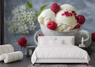 Ricotta vanilla gelato with raspberries and elderflowers in ceramic mug on grey background Wall mural