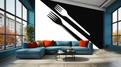  A white fork lies on a black background and a black fork lies on a white background. Wall mural