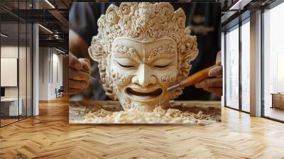 A skilled artisan carefully carves a detailed wooden mask, surrounded by wood shavings, highlighting the precision and craftsmanship of traditional art. Wall mural