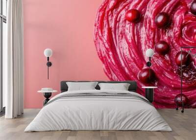 A close-up image of rich red cranberry sauce, highlighted by fresh cranberries, offers a tantalizing view of this deliciously festive culinary creation. Wall mural