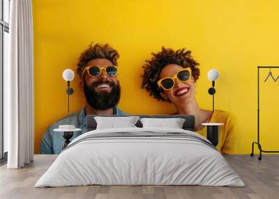 A couple is seen posing closely against a bright yellow background, showcasing their affection and connection while bringing a lively and cheerful aesthetic to the photograph. Wall mural