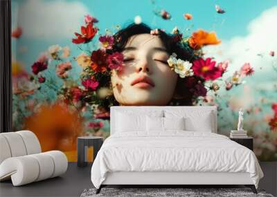 A woman stands in a field of vibrant flowers, eyes closed in tranquility, representing harmony with nature and the vibrant energy of colorful floral beauty. Wall mural