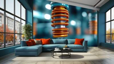 An image of a vertically positioned dynamic coil with vibrant orange and blue colors against a blurred industrial background, highlighting engineering aesthetics. Wall mural