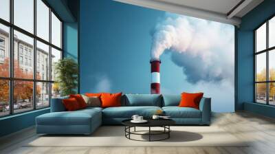 An industrial smokestack is releasing thick white smoke into the sky, symbolizing air pollution and industrial activity, set against a clear blue background. Wall mural