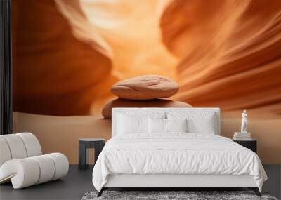 This image features a serene desert canyon scene with two perfectly stacked smooth stones, capturing the essence of balance and tranquility in nature's beauty. Wall mural