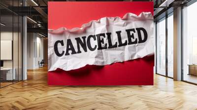 Dramatic torn paper with bold cancelled text in black and red representing cancellation notice Wall mural