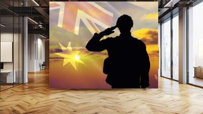 Silhouette of a soldier with a background of the Australia flag and a sunset or sunrise. Concept of national holidays. Commemoration Day. Wall mural