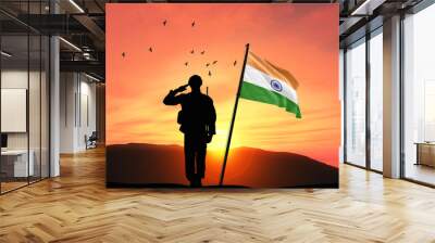 Silhouette of a soldier with the India flag stands against the background of a sunset or sunrise. Concept of national holidays. Commemoration Day. Wall mural