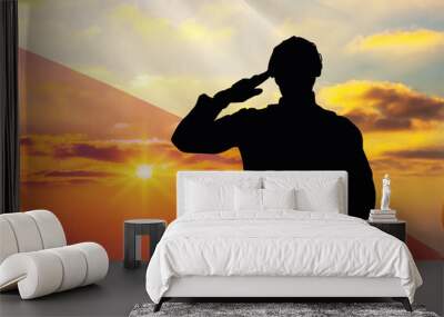 Silhouettes of soldiers with a background of the Poland flag and a sunset or sunrise. Concept of national holidays. Commemoration Day. Wall mural