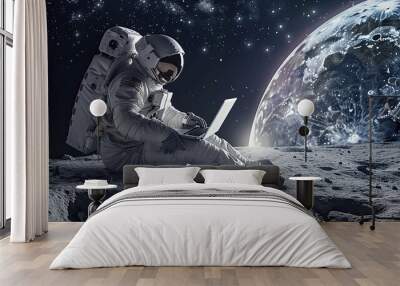 Astronaut in space with a laptop, setting on the moon Wall mural