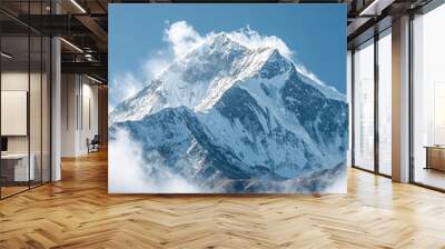 Majestic Mountain Peak Surrounded by Puffy Clouds and a Clear Blue Sky Wall mural