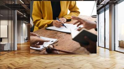 Lawyer is explaining contract details to client at a meeting in the office. They are discussing terms of agreement before signing Wall mural