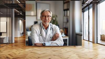 Portrait of confident senior man doctor sitting in a medical office, advice and consulting in clinic, therapist, healthcare Wall mural