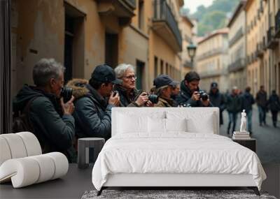 Outdoor photography workshop in historic european city street with group of enthusiasts. Wall mural