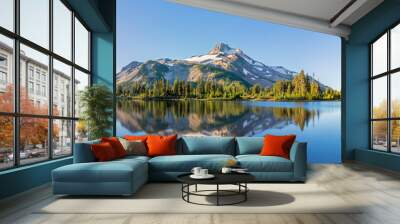 Volcanic mountain in morning light reflected in calm waters of lake.  Wall mural