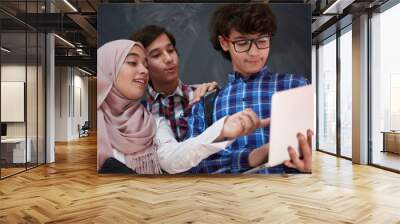 Arab teenagers group working on laptop and tablet computer Wall mural