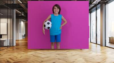 arabic boy with soccer ball against pink background Wall mural