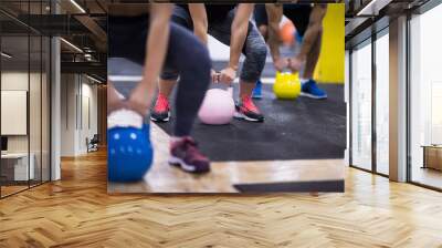 athletes doing exercises with kettlebells Wall mural