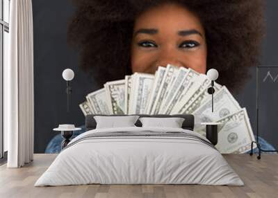 black woman holding money on gray background Wall mural