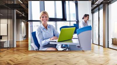 business woman with her staff in background at office Wall mural