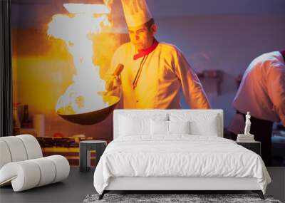 Chef doing flambe on food Wall mural