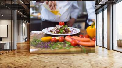 Chef finishing steak meat plate Wall mural