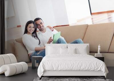 couple at modern home using tablet computer Wall mural