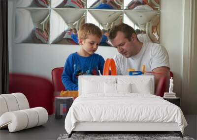 Father and children playing car toy game Wall mural