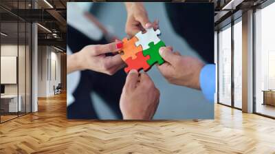 Group of business people assembling jigsaw puzzle Wall mural