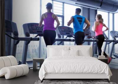 Group of people running on treadmills Wall mural