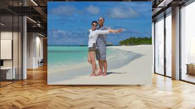 happy young  couple at summer vacation have fun and relax at bea Wall mural