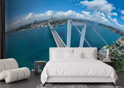 Istanbul Bosphorus Bridge and City Skyline in Background with Turkish Flag at Beautiful Sunset, Aerial slide orbiting and tracking shot Wall mural