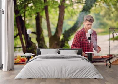 man cooking tasty food for french dinner party Wall mural